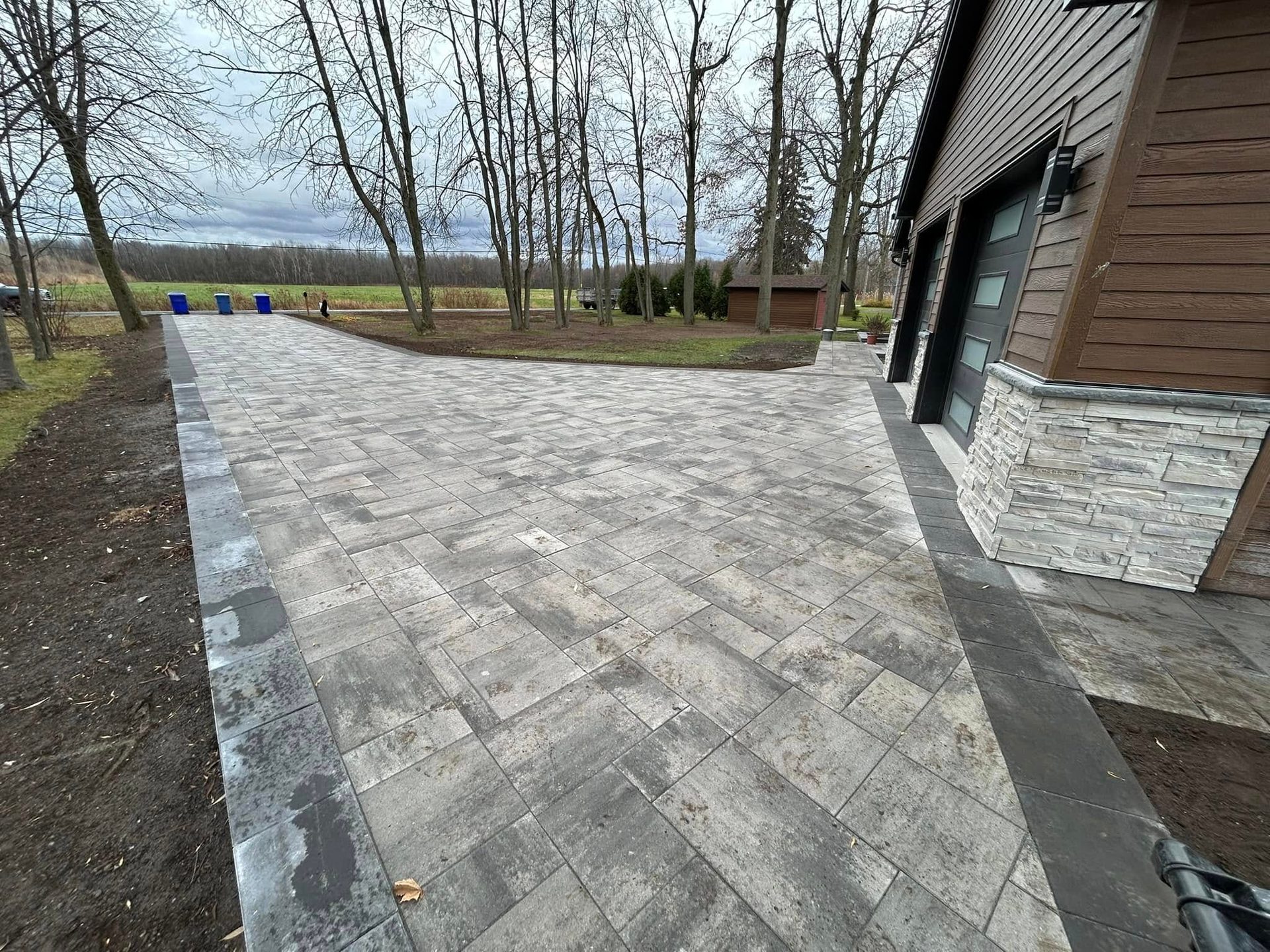 Waterfront paver driveway seen from the side